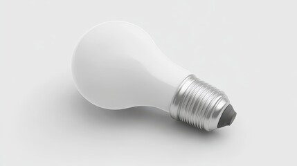 Simple white light bulb on a plain background.