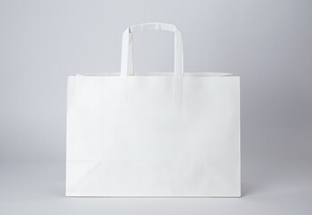 White paper bag with handle isolated on white background