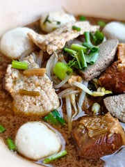 Savory Soup with Meat and Vegetables in a Bowl