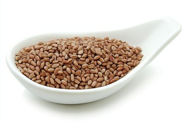 Brown seeds in a white ceramic dish, isolated on white background, perfect for food photography
