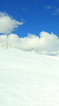 Serene winter landscape near Oy, where snow blankets the valleys and alpine forests in silence