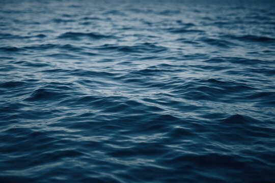 Calm ocean waves at dusk.