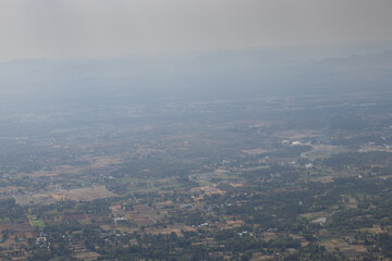 Aerial view of village of yelagiri from the mountain top, a top view, mountains covered with mist. Yelagiri hill station, nearest to Chennai