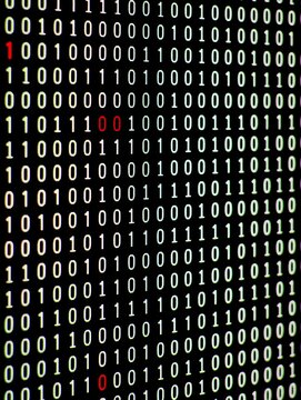 Binary code matrix with highlighted digits on black background, classic digital programming aesthetic representations of technology information.