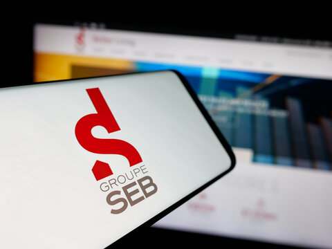 Stuttgart, Germany - 04-25-2025: Smartphone with logo of French appliances company SEB S.A. on screen in front of website. Focus on center-left of phone display.