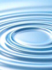 Concentric ripples spreading across a calm, light-blue water surface