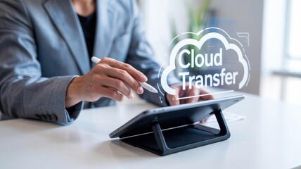 Businessperson interacts with a cloud transfer application on a tablet.