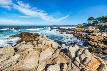 Stunning coastal landscape along California's Highway 1, featuring rugged rocky formations, and the vast blue ocean. A breathtaking natural scene showcasing the raw beauty of the Pacific coastline