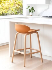 A tan-colored kitchen stool with wooden legs stands in front of a white kitchen counter, showcasing a minimalist modern design