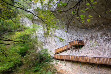 Chernigovka, Abkhazia October 14, 2024: Suspension bridges in a mountain gorge, to move tourists to observation platforms. Warm autumn day. Cloudy