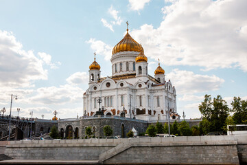 Cathedral of Christ the Savior with the Patriarchal Bridge on a clear sunny day, Moscow.  Sights of Russia. Architecture of World tourism.