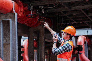 Engineer under checking the industry cooling tower air conditioner is water cooling tower air...