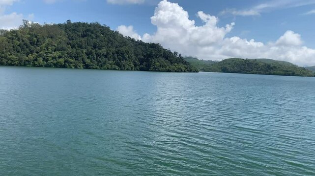 Lush green tea plantation at Valparai, The beautiful Valparai river meanders through the estate. Kerala tourism. God's own country. 
