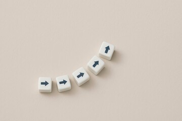 White Cubes with Arrows Upward and Rightward Trending Growth Success Concept Minimalist Beige Background Simple Design Modern Business Strategy Direction Planning Future Goals Achievement Progress    