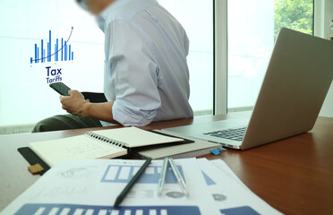 Businessman Using Mobile for Tax Planning