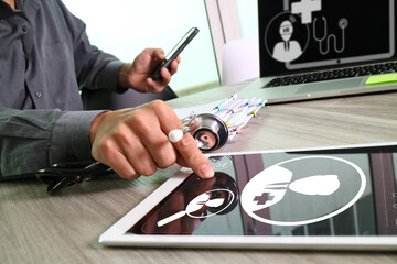 Doctor Using Tablet with Digital Health Interface