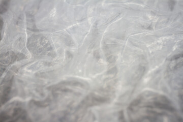 Extreme macro of plastic bubble wrap texture. Selective soft focus, shallow depth of field. Abstract dreamy background