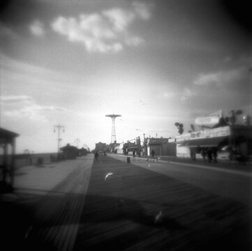 Old Fashioned black and white image of the Coney Island boardwalk, Coney Island, Brooklyn, New York City, United States