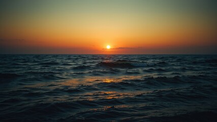 Fototapeta premium Peaceful Ocean at Dusk - Still Waters, Dark Hues