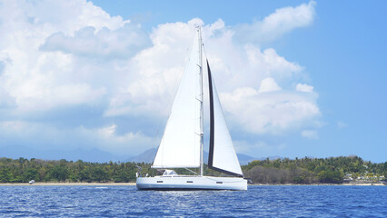 Sailboat Leaving the Shore for an Ocean Adventure