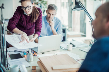 Fototapeta premium Group of people working together on a project in a startup company office