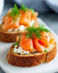 Artisan bread sourdough top view. Fresh smoked salmon on rustic bread with cream cheese and dill, served as a gourmet appetizer.
