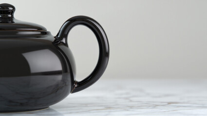 white teapot and cup on black background