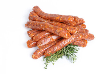 A group of raw merguez sausages arranged on a white background