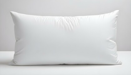 A pristine white pillow presents an invitation to relax and rest, set against a minimalist backdrop.