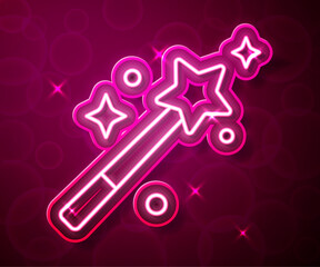 Glowing neon line Magic wand icon isolated on red background. Star shape magic accessory. Magical power. Vector