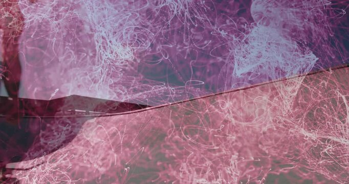 male skateboarder performing grind on ramp in sports marketing, with swirling pink light trails