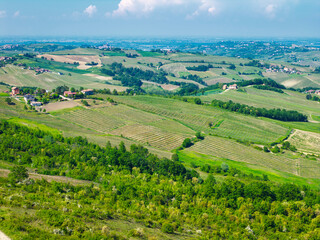 Springtime aerial view, taken by a drone, of the Oltrepo Pavese hills, near the town of Montalto Pavese (Lombardy, Northern Italy); the hills are crossed by a network of trails, fit for easy trekkings