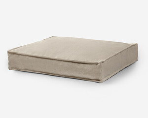 Comfortable pet bed resting on white background