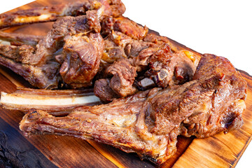 Grilled meat served on wooden platter at outdoor cookout