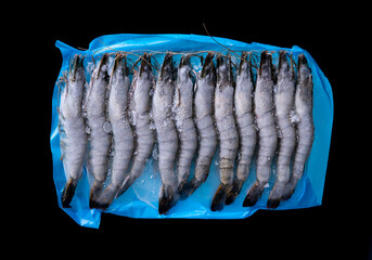 black tiger prawns on dark background , frozen fresh food
