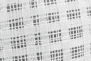 White textile with woven pattern