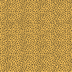 Seamless abstract animal-style micro pattern with small irregular black shapes on warm yellow. Playful modern background, perfect for fashion, textiles, wallpaper, packaging, and bold design.