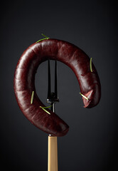 Black pudding or blood sausage with rosemary.