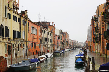 Old houses facades and channel in the old center of Venice, Italy     