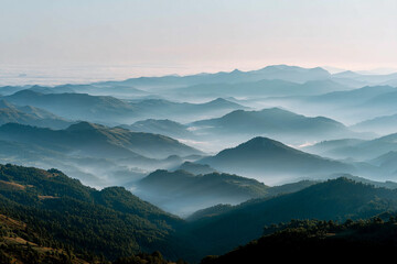Fototapeta premium Stunning panoramic view of misty mountains at dawn captures nature's tranquility in vibrant colors