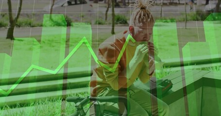 man eating sandwich on urban park bench, overlaying technology bar charts and line graph animation - Powered by Adobe