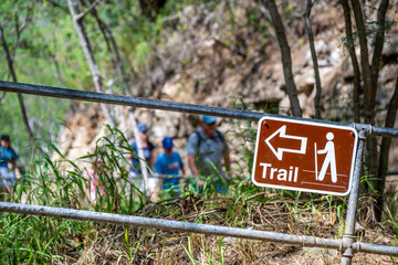 Selective focus on inclined hiking sign along the trail to the summit of Diamond Head State Monument in Oahu, Hawaii 