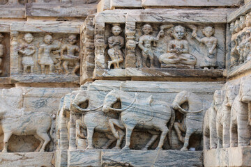 Horses with harness - Detail of decorative stone carving on the walls of the Jagdish Temple in Udaipur, Rajasthan, India.
