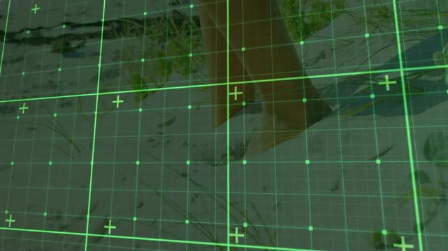 lower legs and bare feet walking across sandy dune ground under HUD green grid overlay mapping