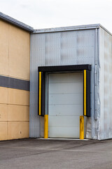 Modern Industrial Loading Dock with Safety Bollards and Rolling Door