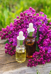 Lilac flowers extract and dietary supplements. Selective focus.