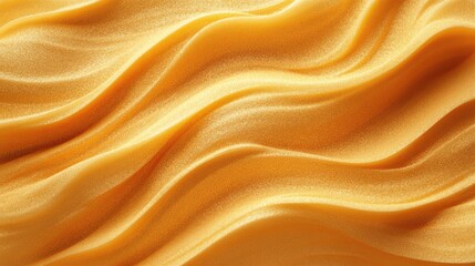 Obraz premium Golden fabric drapes in flowing, elegant waves.