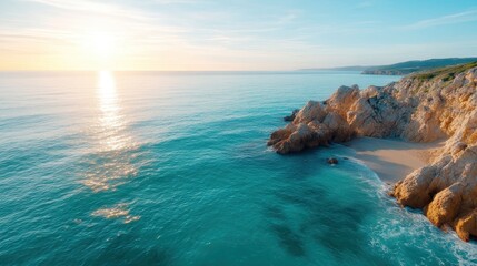 A breathtaking view of the sun setting over a rocky coastline, casting golden hues on gentle ocean waves and highlighting the natural beauty of the landscape.