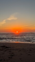 Golden sun dips beneath whispering waves, Taurus New Moon rising, coastal divination, mystical...