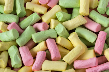 Colored marshmallow background , top view , flat lay .